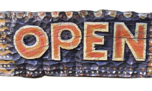 An Open sign from a rustic cafe